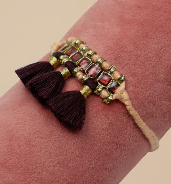 Tasselled bracelet in petal and plum - Powder Design