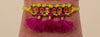 Tasselled bracelet in mustard and fuchsia - Powder Design